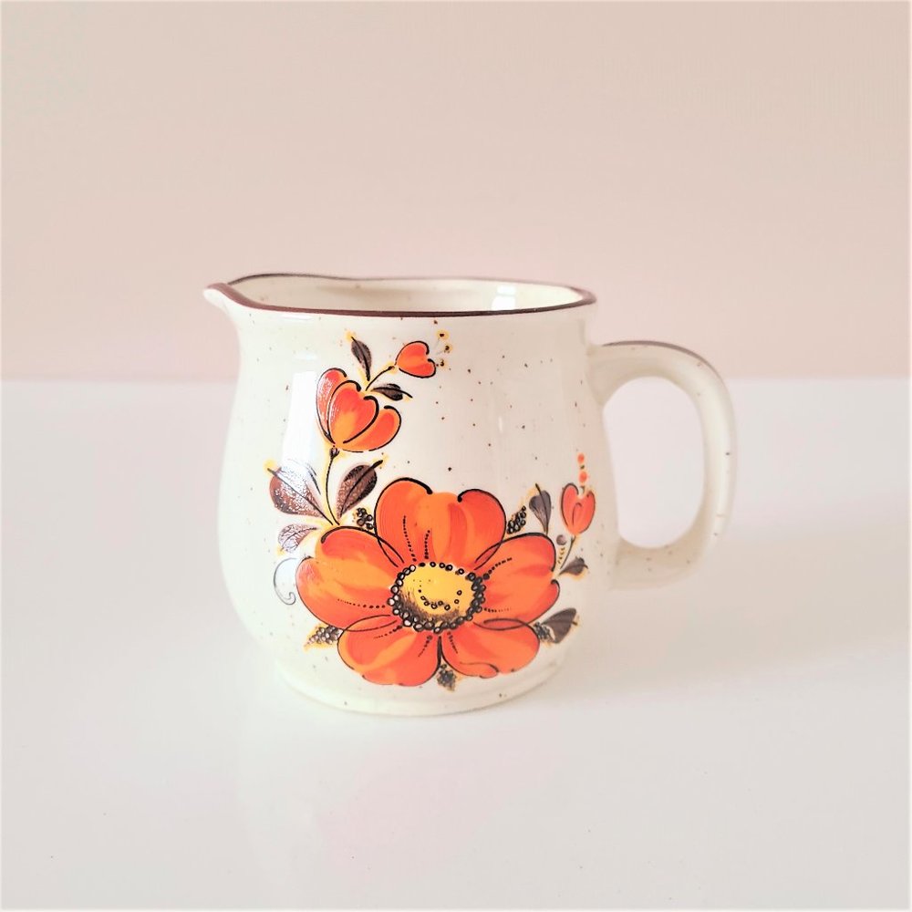 Vintage creamer with orange flower. Made in Japan.